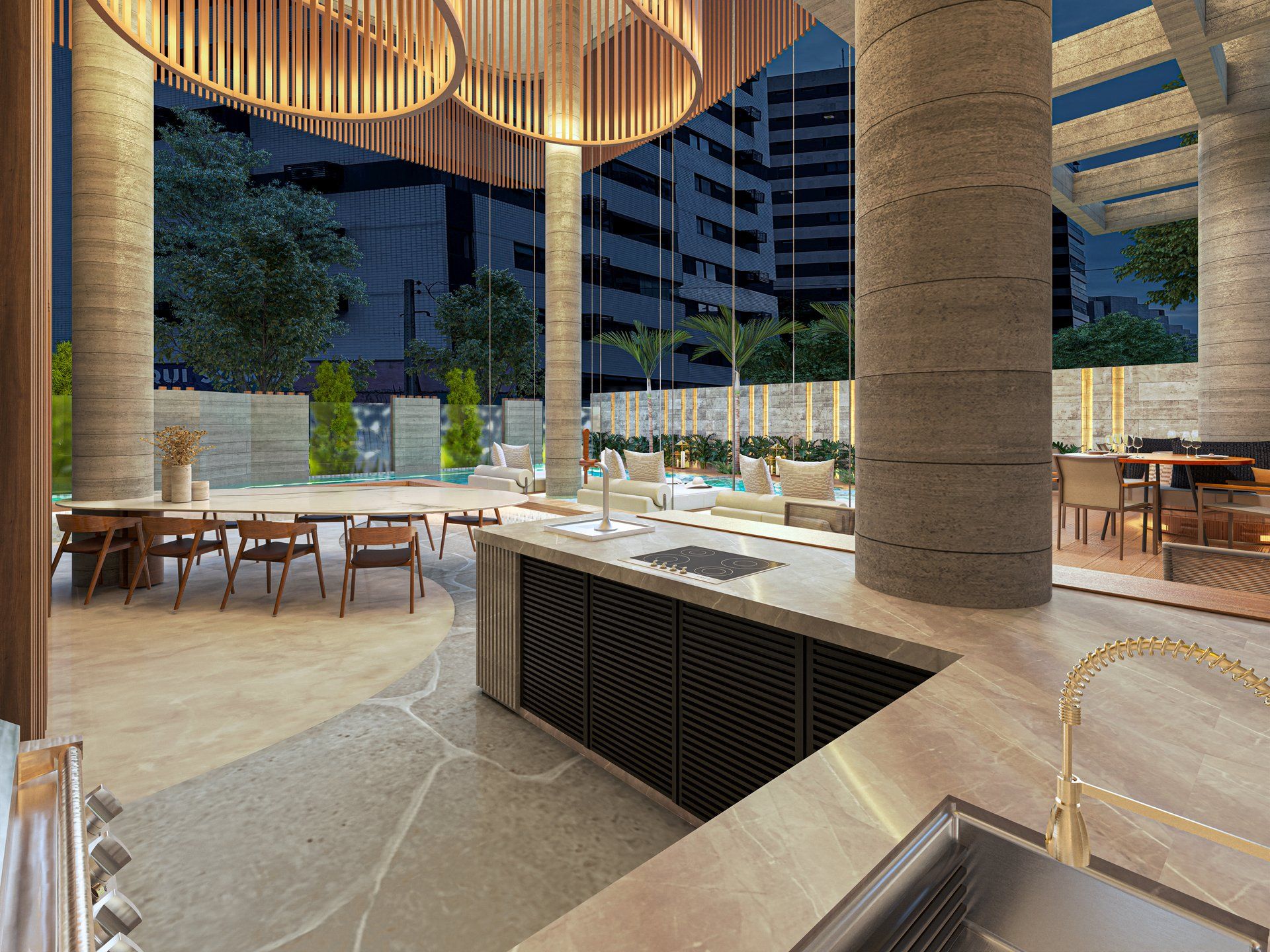 Área gourmet com ilha de cozinha e vista para a piscina à noite