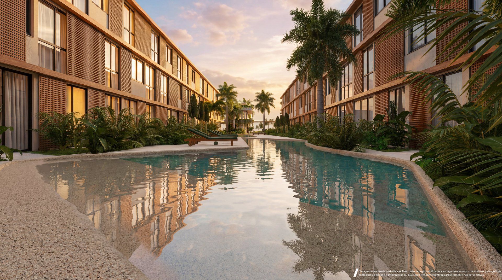 Piscina de formato orgânico com espreguiçadeiras e vegetação exuberante ao entardecer