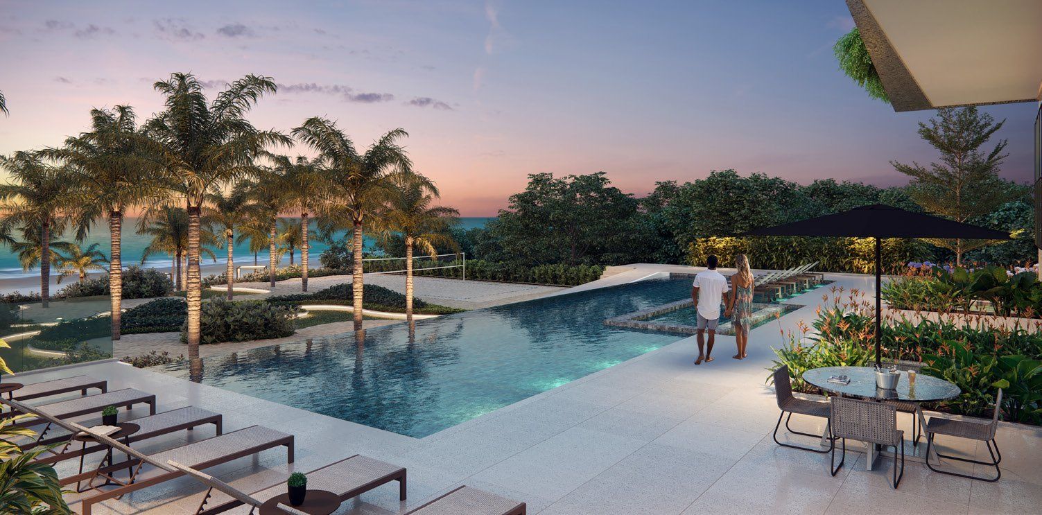 Piscina de borda infinita com lounge e bar