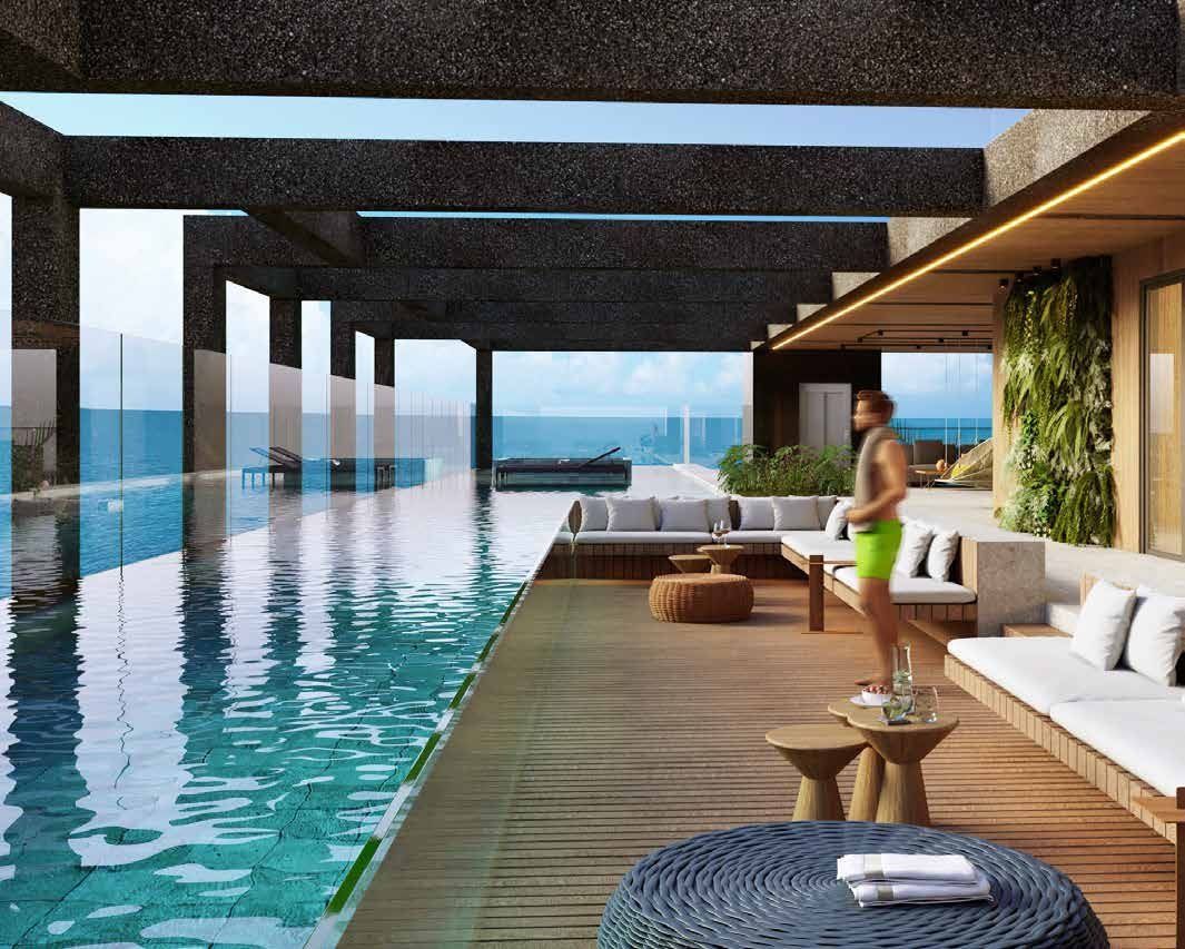 Piscina de borda infinita na cobertura, com deck e lounge voltados para o mar
