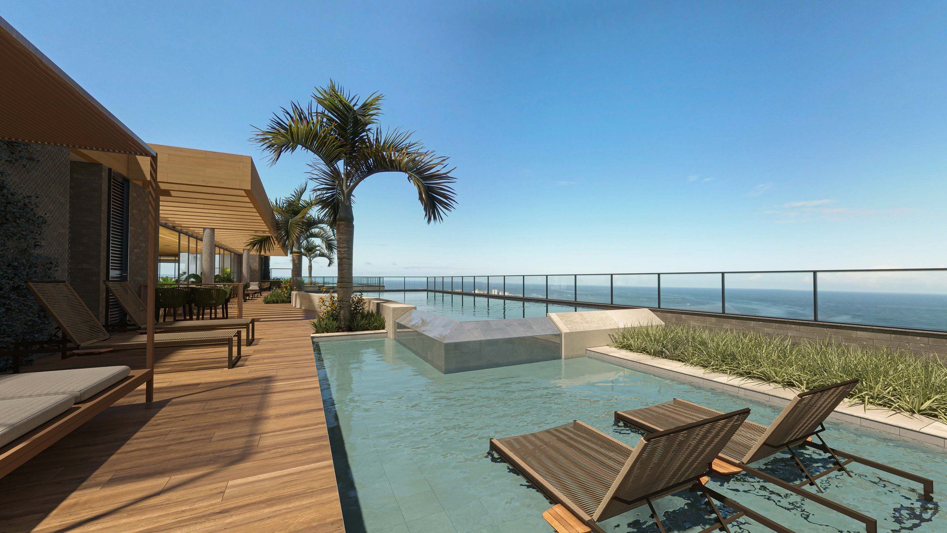 Piscina na cobertura com deck em madeira e vista para o mar