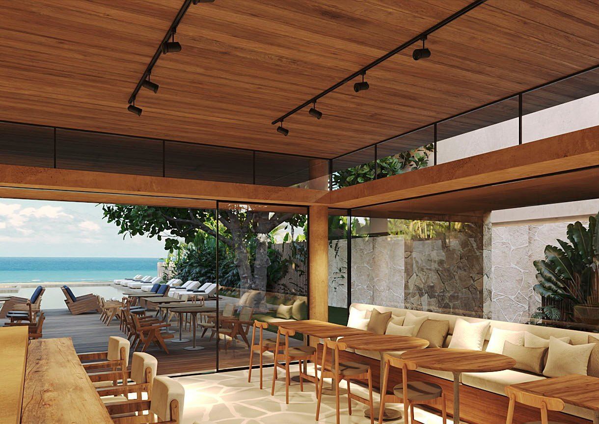 Lounge à beira da piscina, aberto para o mar.