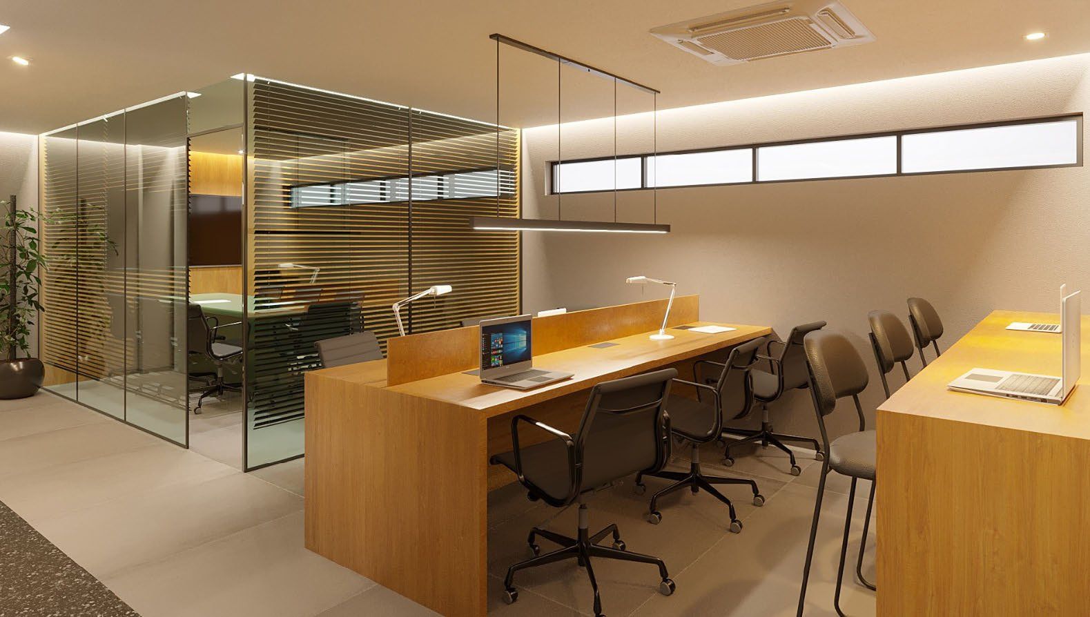 Coworking com estações de trabalho e sala de reunião.