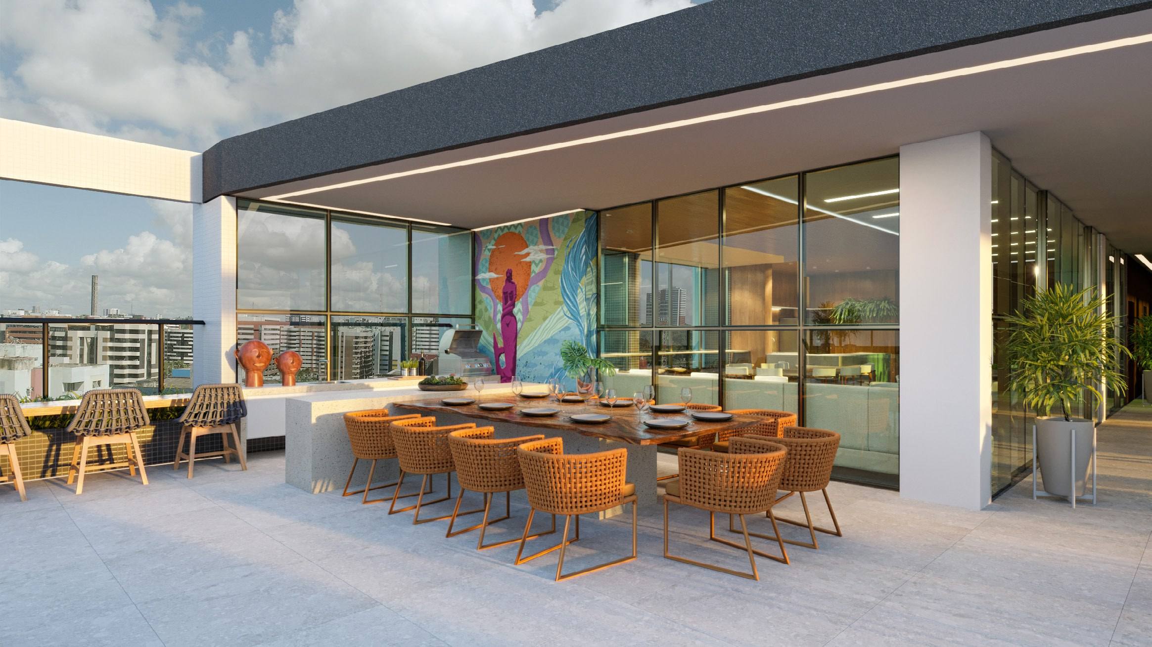 Espaço gourmet externo com churrasqueira e mesa de jantar